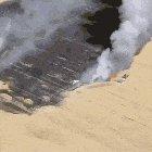 farmer with pressence of mind cutting off crop fire