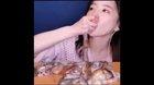 Girl eats a live octopus!
