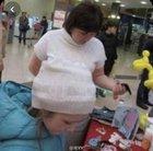 Wait, is that person up her shirt?