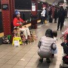 He sings pretty woman with his dolls. 53rd &3rd ave street M/E train station