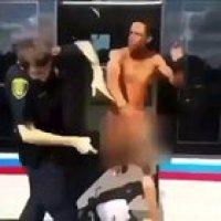 Naked man slaps cop.