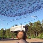 Drones lifting a truck