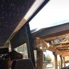 Bus almost makes it around a corner