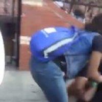 Lady gets punted while interfering with an arrest.