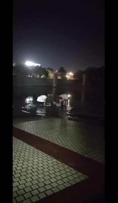 Lightning strikes tower in Anhui, China, killing 2 and injuring 7 standing in puddles around the tower.