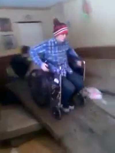 WCGW wheelchairing down a ramp in an abandoned trailer