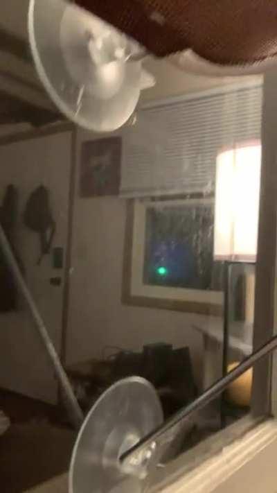 Heard a strange noise and started recording, discovered mid video it was from faulty power line outside during the middle of an ice storm
