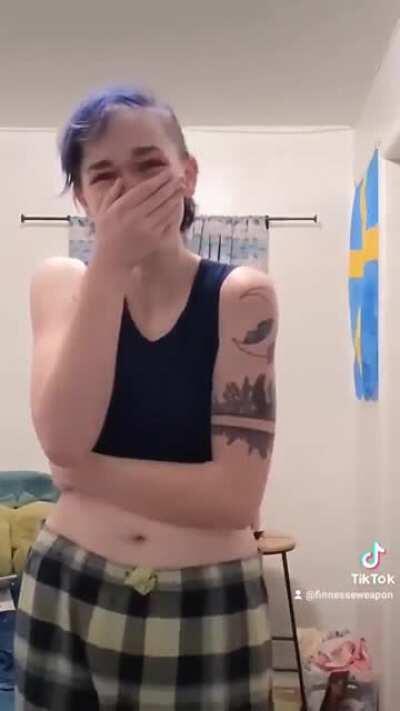 This nonbinary person's reaction to seeing themself in a binder for the first time!