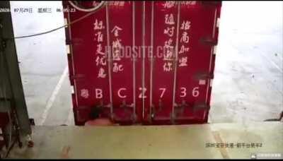 Ouch! For reference, loading docks have very thick rubber (you can see them sticking out), so the guy is ok, but he just got the wind blown out and got the scare of his life!