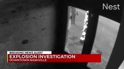 CCTV camera captures the moment of the explosion in Nashville as a police officer is attempting to clear the area.