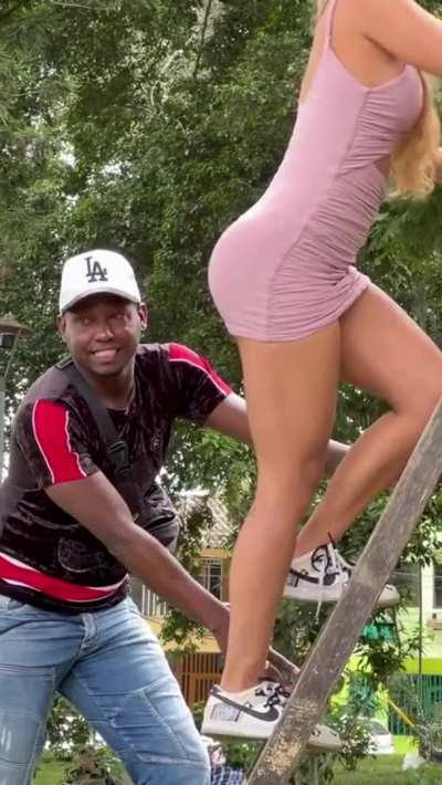 Beautiful Blonde Climbs Stairs in a skirt and teases men