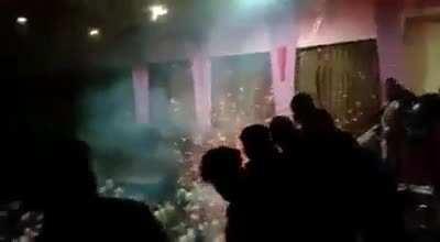 Celebrating the entry of their favourite movie star by bursting firecrackers in a closed movie theatre. Salman Khan fans