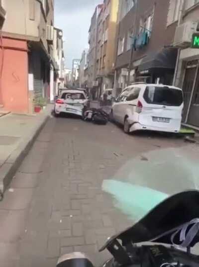 WCGW popping a wheelie in a narrow traffic filled street