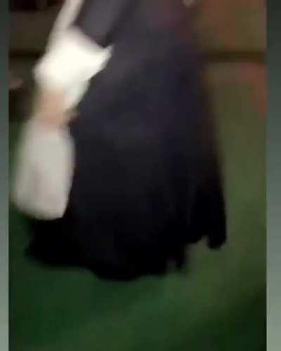 Twerking her booty in a maid dress