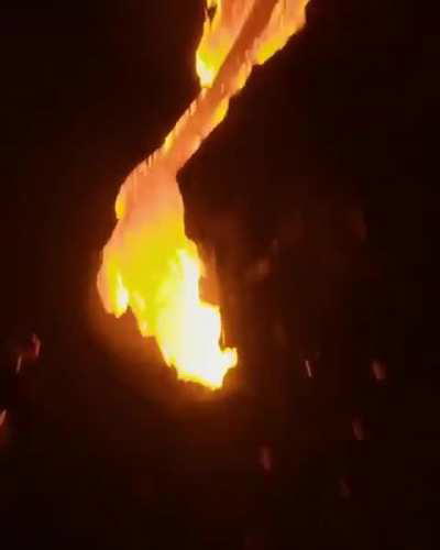 Drone soaring trough erupting volcano