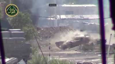 An FSA fighter spotting a tank gets shot at directly - Jobar 2013 - Al-Baraa Brigade