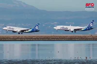 Two Alaska Airlines aircraft land together