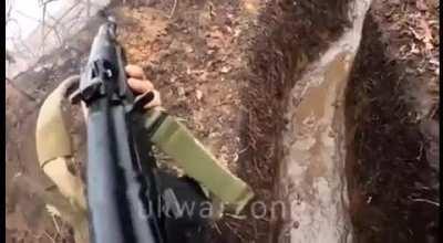 Ukrainian soldier defending his muddy trench position using indirect RPG fire and small arms fire. (Bakhmut, February 2023)