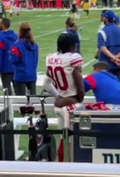 NY Giant Darnay Holmes gets a cramp.