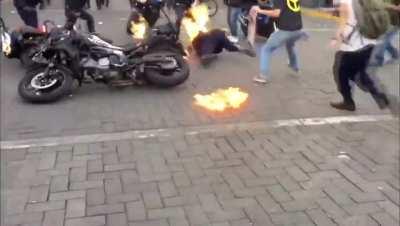 Mexican police officer set on fire during protests in Guadalajara.