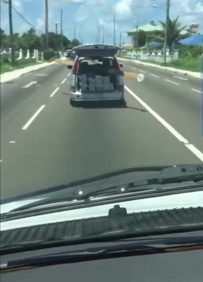 Wcgw loading a plank on a van diagonally and driving on the  highway