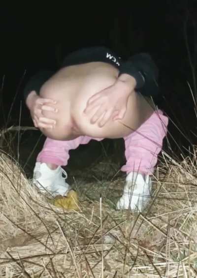 Shitting in the dark outside