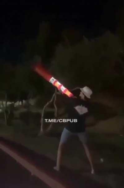 Putting fireworks in a traffic cone and holding it next to your face