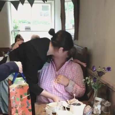 A regular customer's heartwarming reaction to a free cake on her birthday