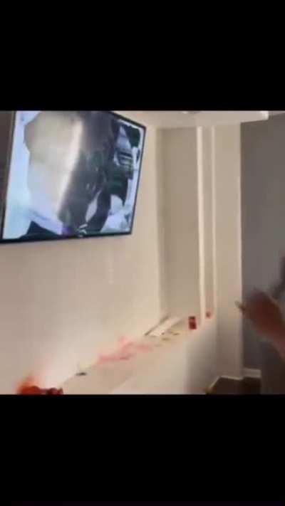 Idiot fighting tv because Mexico lost against Argentina