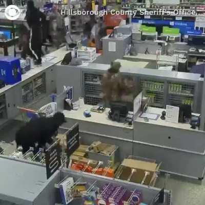 Surveillance footage shows hundreds of looters breaking into a Florida Walmart and stealing more than $100,000 worth in merchandise.