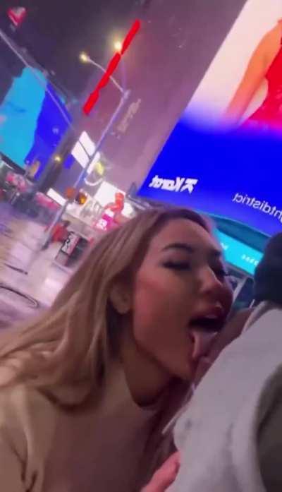 Kazumi in front of her billboard