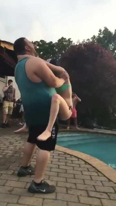 trying to throw a girl into the pool. I hope she is okay