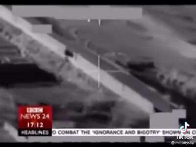 Royal Marine catches a ride on the side of an apache