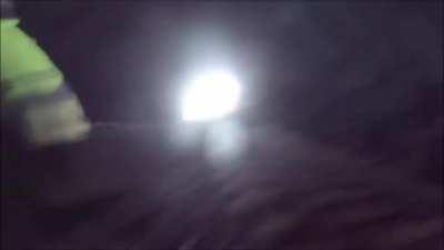 Lucky cyclists narrowly escape a train in tunnel