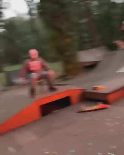 Guy does a skateboard trick