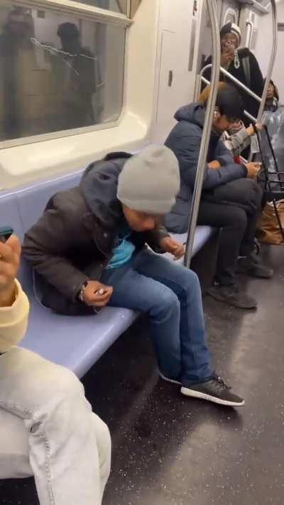 Woman smokes crack on the subway in the Bronx.