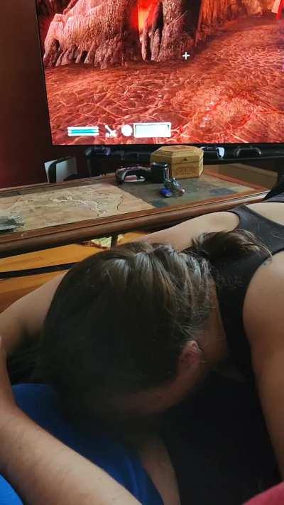 Giving Daddy some oral support. Not sure it helped him concentrate