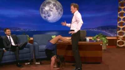 Nina Dobrev uses Conan O'Brien as her human Yoga Wall