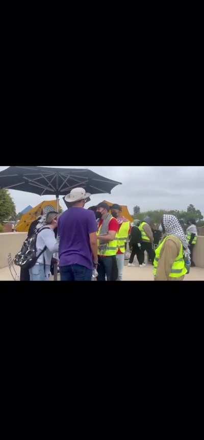 woman yells at the protestors at a university