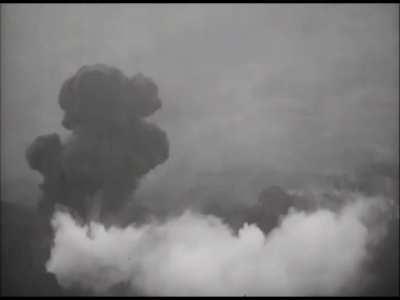 P-38 Lighting spotting for F4U Corsairs dropping napalm on Okinawa on June 15th 1945