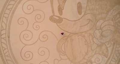 This guy doing beach art