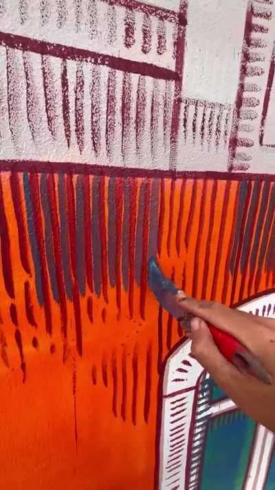 Cool street art of buildings on a building, by Francisco Fonseca.