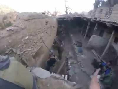 Some guy playing clash of clans in the middle of a firefight.