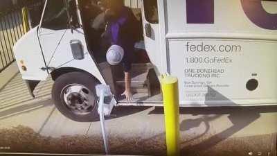 WCGW leaning out of an open door delivery truck with no seatbelt on