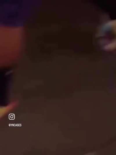 Street vendor aggressively shepherds blind man towards watering hole