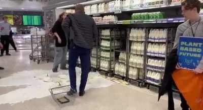 Animal Rebellion Protesters Pour Milk in Shops Across UK