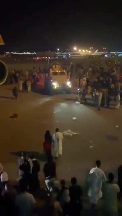 Thousands of people clamor to get out at Kabul airport