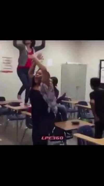Dancing girl knocked off school desk