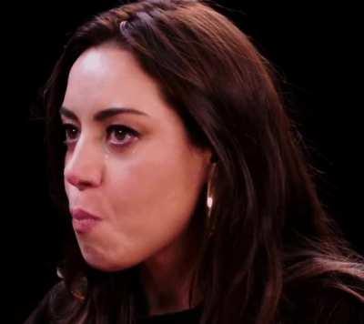 Aubrey Plaza swallows