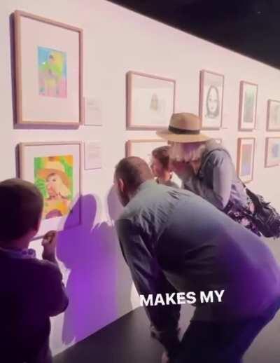 Nephew surprises his aunt with a painting he made of her that earned finalist placement in an art competition